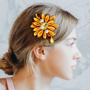 A woman wearing large flower hair clip