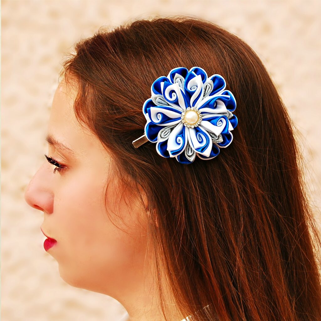 a woman wearing a royal blue white hair clip