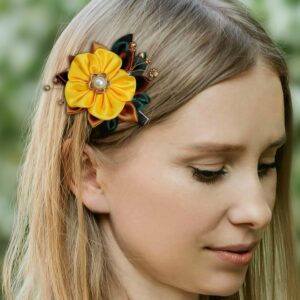 a woman wearing a yellow flower clip