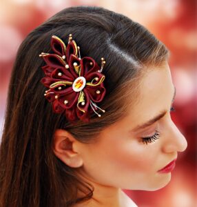 a woman wearing burgundy hair clip