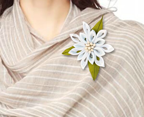 woman with white flower brooch