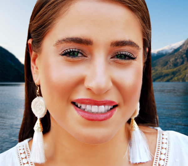 a woman wearing tassel earrings