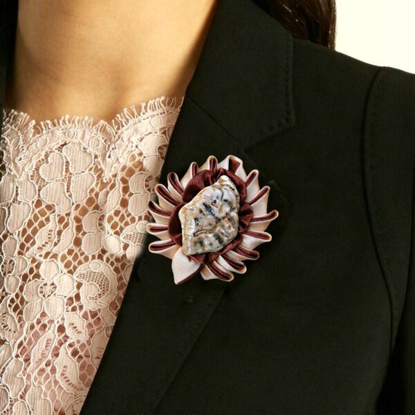 a brooch on a jacket lapel