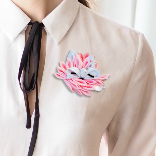 A woman wearing cute animal brooch