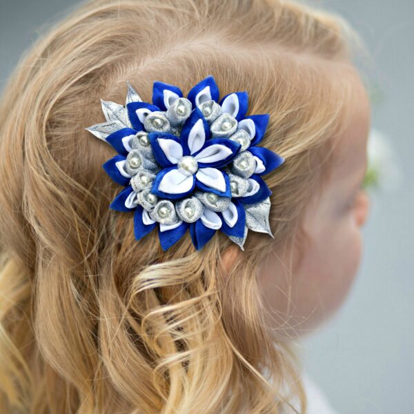 a girl wearing festive hair clip