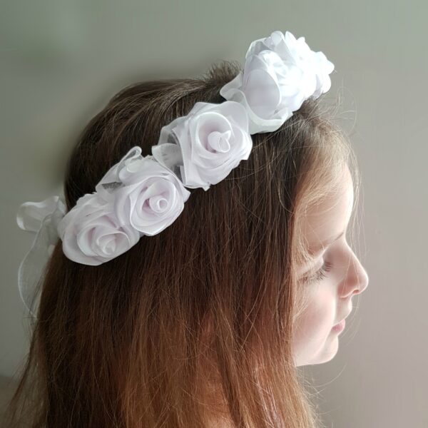 a girl wearing flower hairband