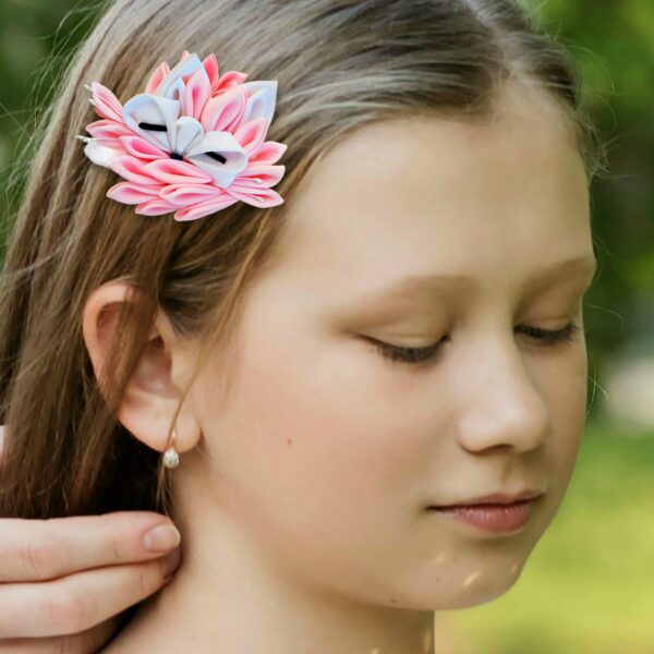 a girl wearing pink fox hair clip