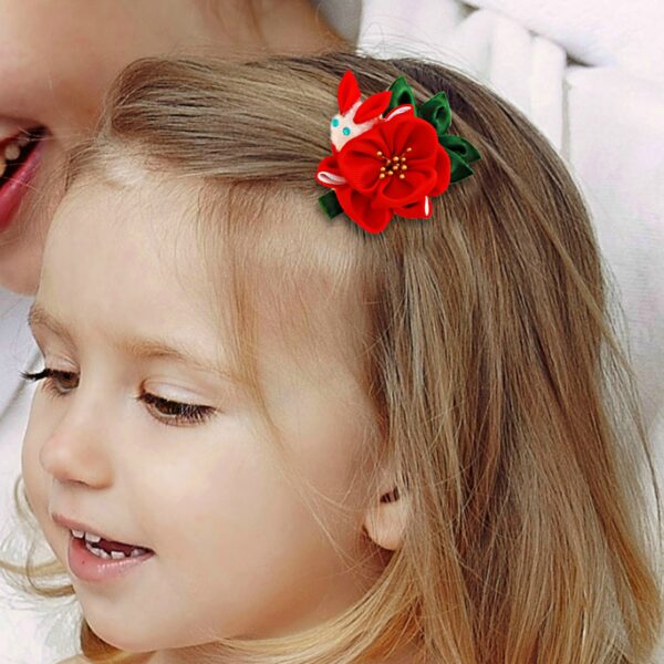 a girl wearing red flower and bunny hair clip