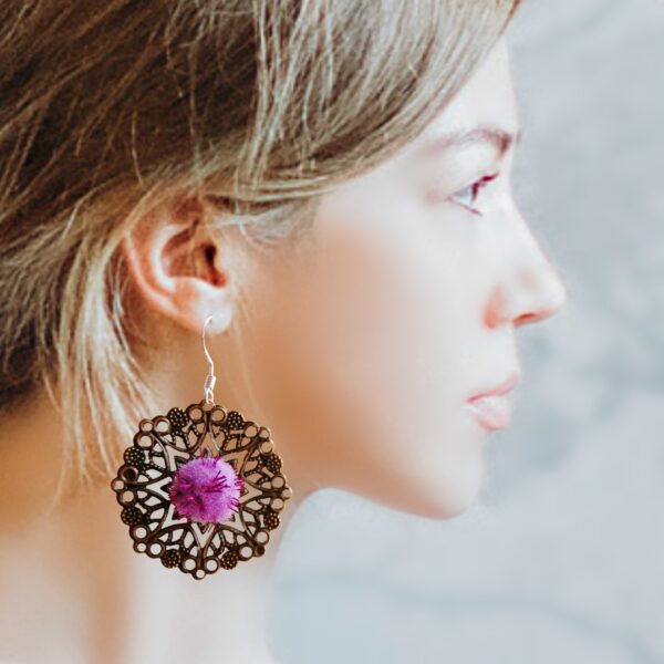 a girl wearing the earrings
