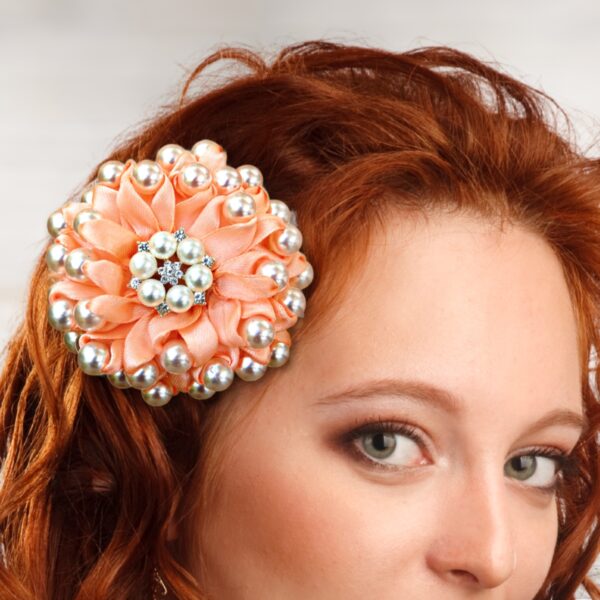 a woman wearing beaded hair bow