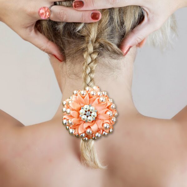 a woman wearing beaded hair bow