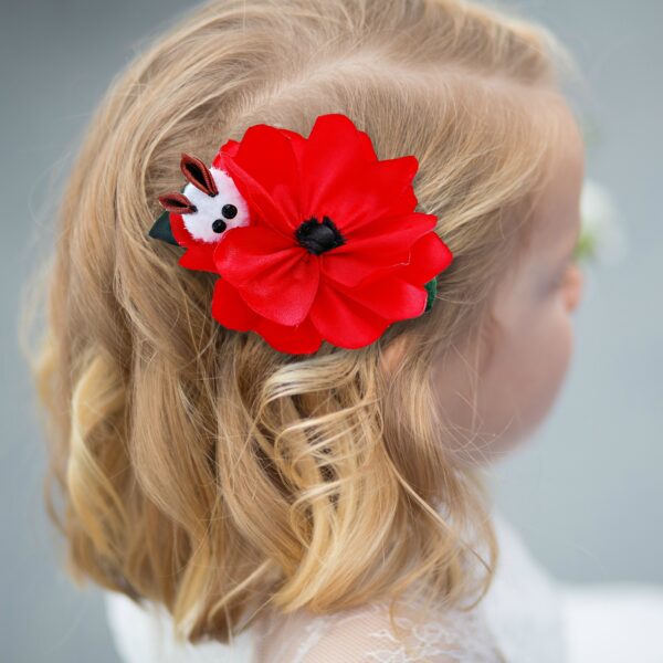 girl with a poppy hair clip