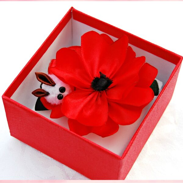 red hair clip in a box