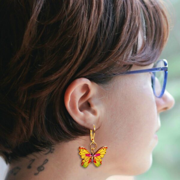 A young woman wearing yellow butterfly charms