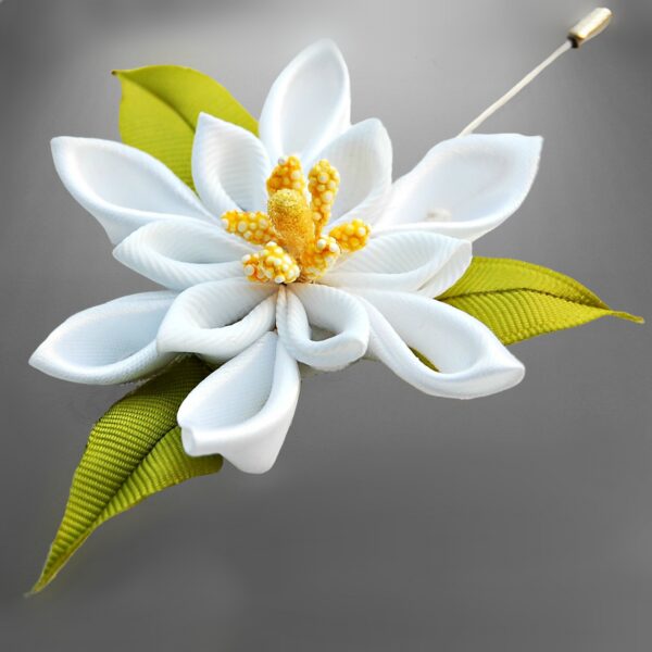 White flower lapel pin