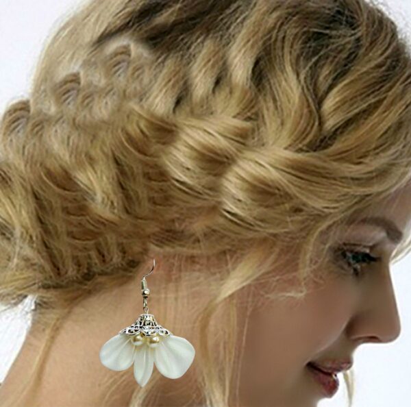 a bride wearing white earrings