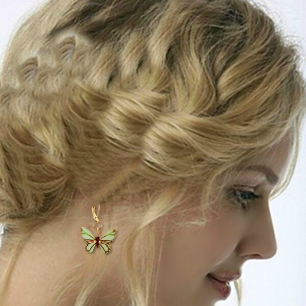 a woman wearring butterfly earrings