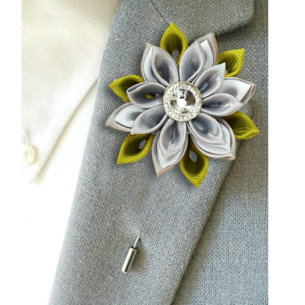 green gray lapel pin on a jacket