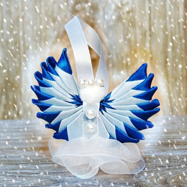 blue white angel in the snow