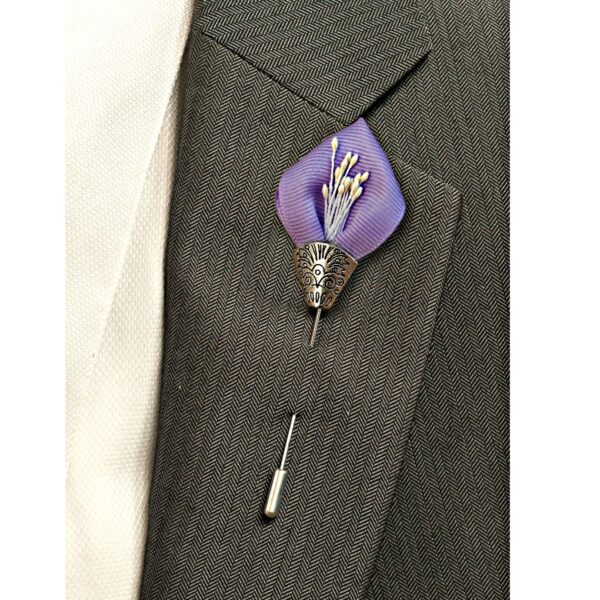 lilac lapel pin on a suit