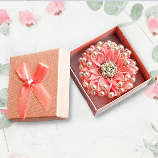 pink Kanzashi flower in a box