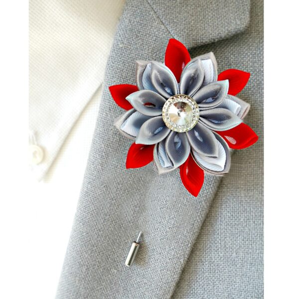 red gray flower pin on a jacket