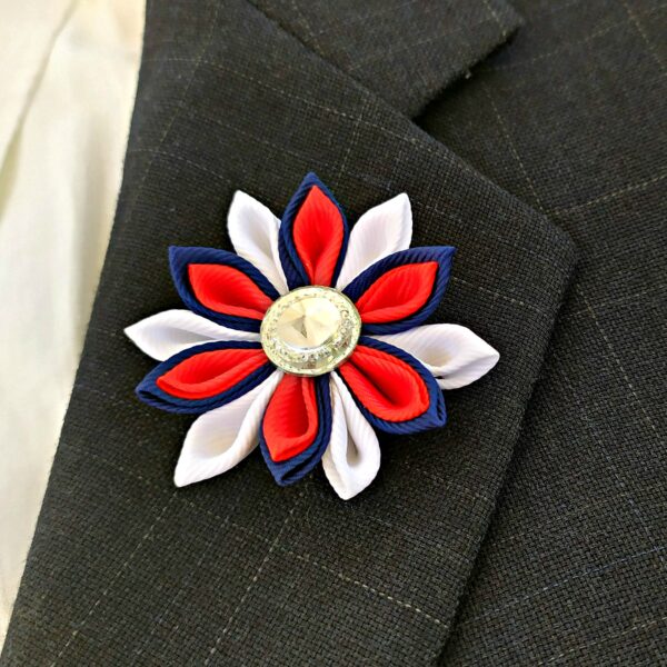 red white blue flower lapel brooch on a jacket