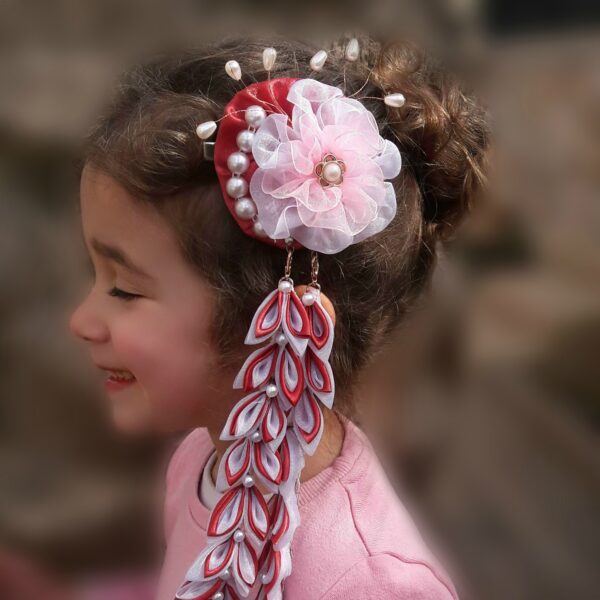A happy girl wearing Kanzashi blush flower hair clip