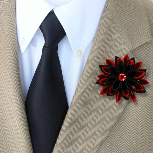 a man wearing red black lapel pin