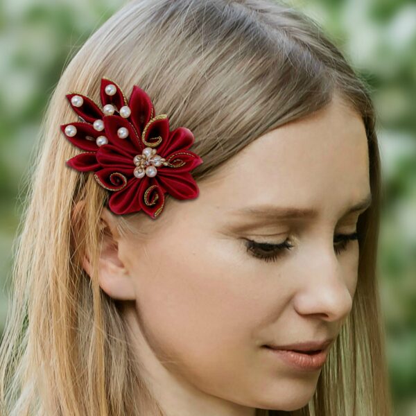 a woman wearing a marsala hair clip