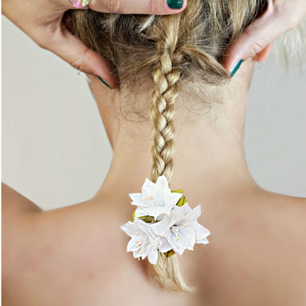 a woman wearing lily hair bow