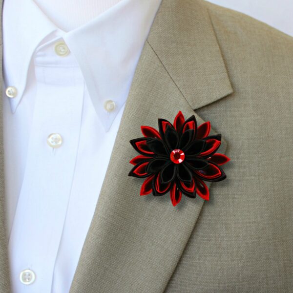 black red flower brooch on a suit