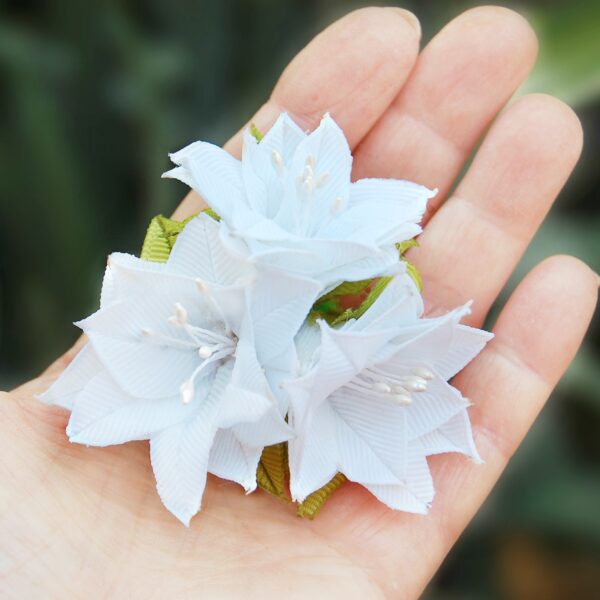 lily hair clip in a hand