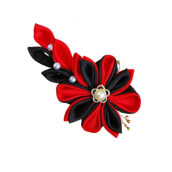 red black brooch