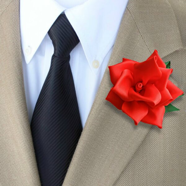 red lapel pin on a suit