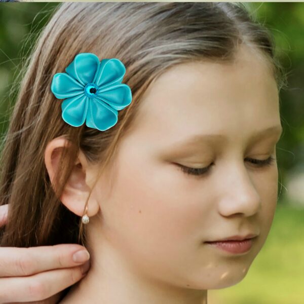 a girl wearing turquoise hair clip