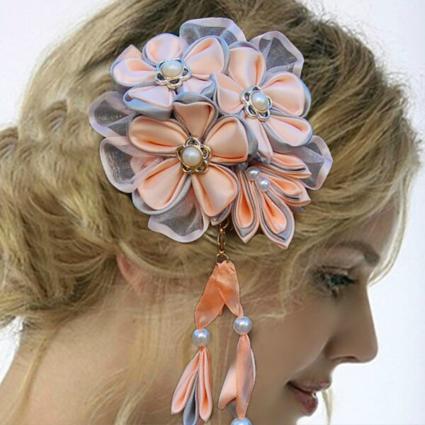 a woman wearing Kanzashi flower dangle hair clip