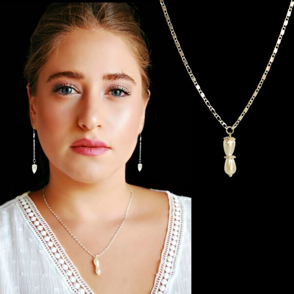 a woman wearing pearl pendant silver necklace