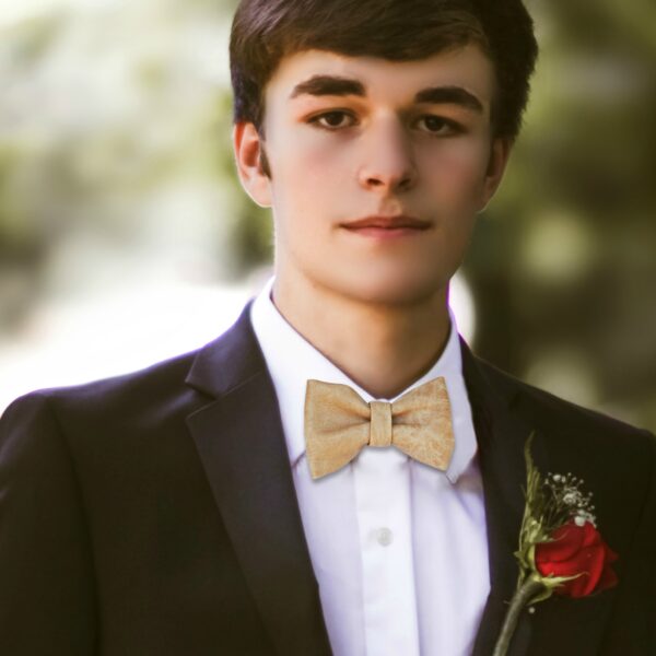 a young man wearing a faux leather bowtie