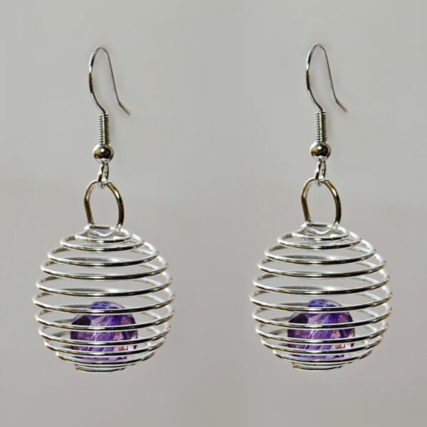 silver spiral earrings with a purple glass beads
