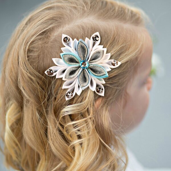 a girl wearing a snowflake hair clip