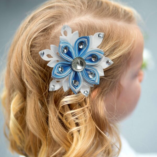 a girl wearing snowflake hair clip