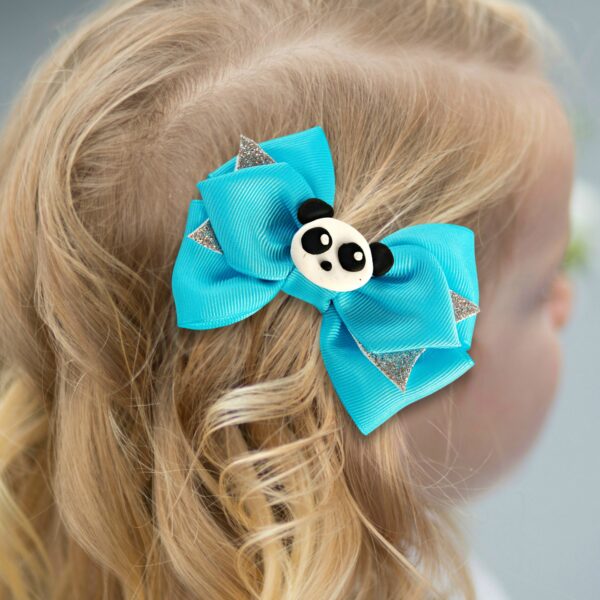 girl wearing panda hair clips