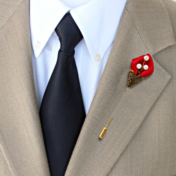 man wearing burgundy lapel pin