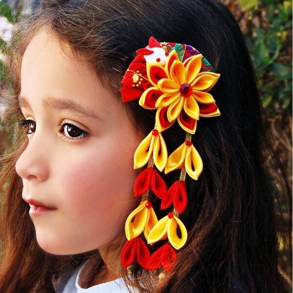 A girl wearing red yellow dangle hair clip