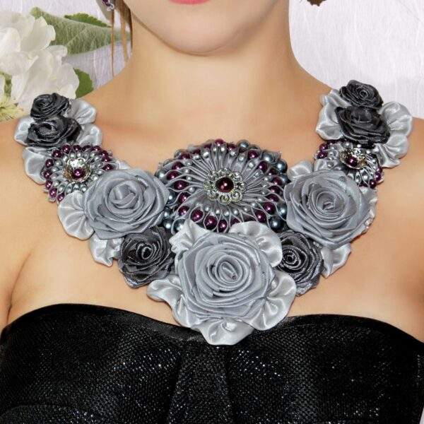 a woman wearing collar bib necklace