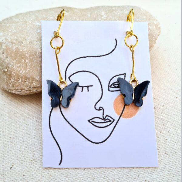 Dangle Black Butterfly Earrings on gold color hughie closure